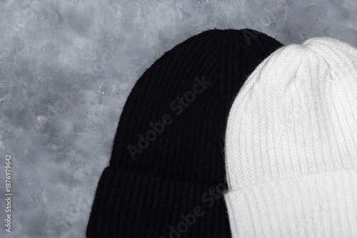 White and black woolen hats. Top view.