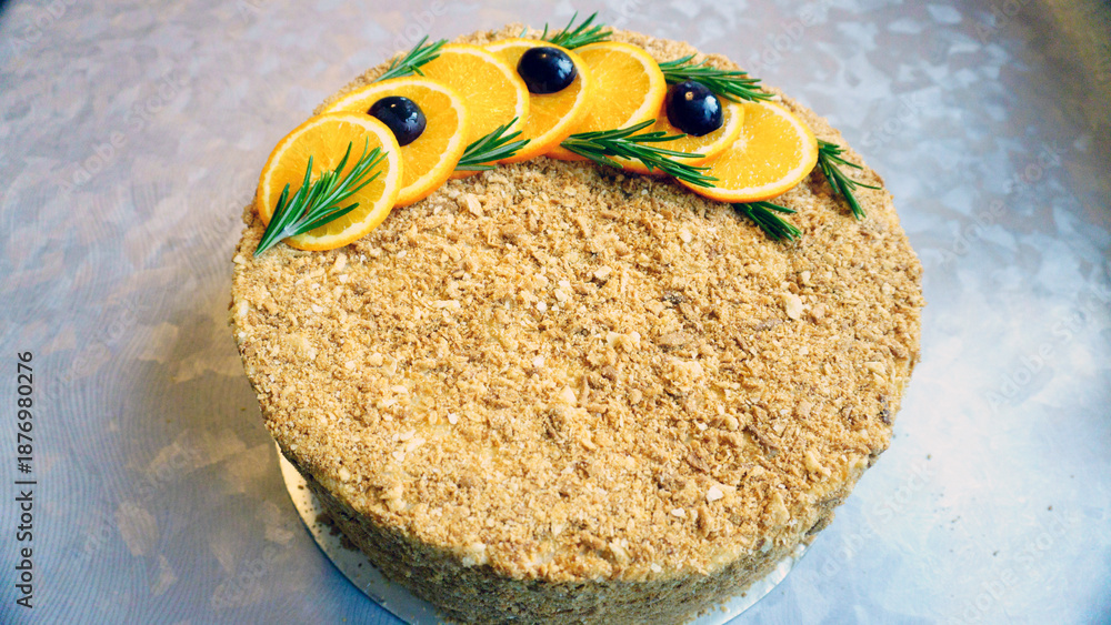 Obraz premium Assortment of Napoleon cake presentations featuring a whole cake, sliced cake, cake missing one piece, and a single slice. Traditional layered pastry dessert with creamy filling, ideal for confectione
