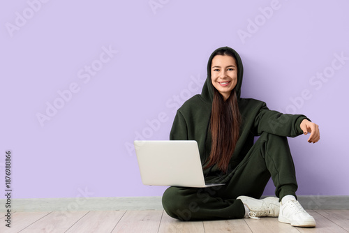 Young woman in khaki sports...