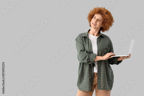 Redhead female freelancer w...
