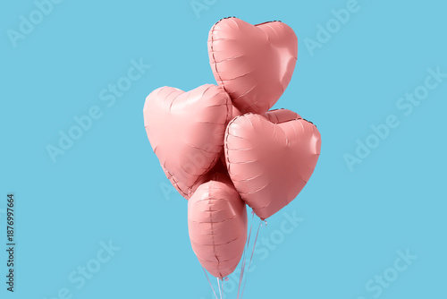 Heart-shaped balloons on bl...