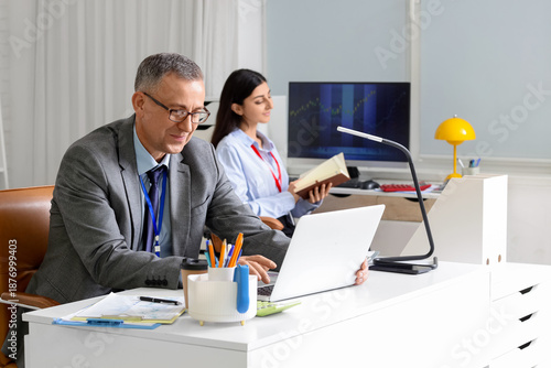 Male business analyst worki...
