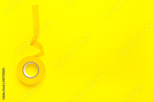 Yellow insulating tape roll...