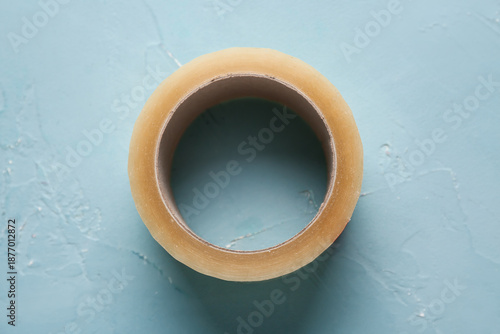 Adhesive tape roll on blue ...