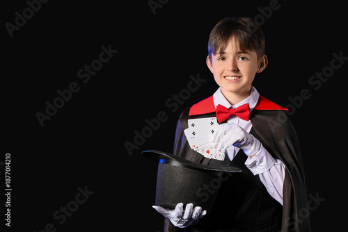 Little magician with hat an...