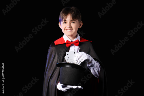 Little magician with hat an...