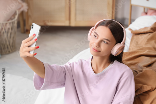 Teenage girl with headphone...