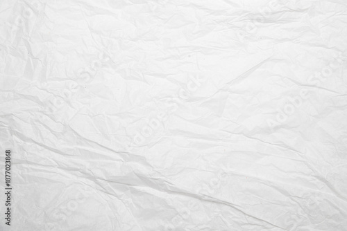 Cuadro en lienzo Primer plano de hoja de papel blanco con arrugas, pliegues y dobleces sobre superficie texturizada