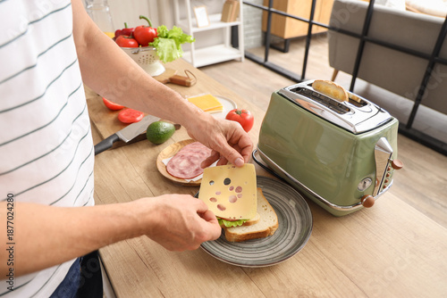 Middle-aged man making deli...