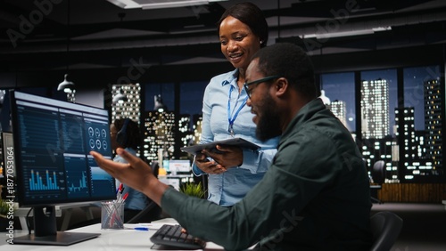 African american coworkers doing high five after successful collaboration, working together for a business mission. Teamwork with unity and support for cheerful people, winning.