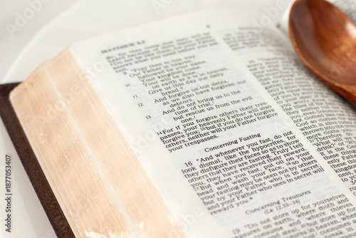 Christian text for fasting in open holy bible book. Close-up. Biblical concept.