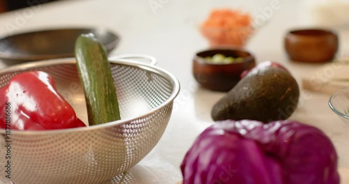 Camera zooming and panning revealing purple cabbage on cutting board with knife waiting for slicing