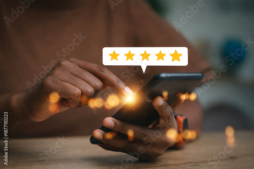 Elevated Experience: The image showcases a person engaging with a mobile phone, and the floating speech bubble display indicates a positive rating.