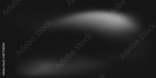 Fotografie Abstract black and grey grainy background with subtle white gradient and noise texture