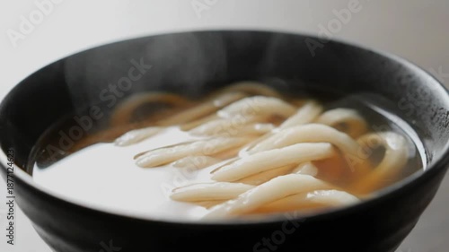 Delicious udon noodles in bowl.