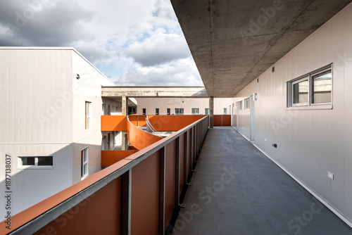 High-quality photo set of a contemporary urban apartment highlighting modern architecture, minimalist interior design, and functional living spaces. The series includes exterior facade, building entra