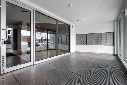 High-quality photo set of a contemporary urban apartment highlighting modern architecture, minimalist interior design, and functional living spaces. The series includes exterior facade, building entra