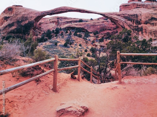 Bild auf Leinwand A bridge spans a canyon in the desert