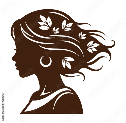 Brown silhouette of womans head with leaves in hair and hoop earring