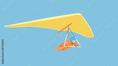 Hang glider flying in the sky with a person suspended beneath.