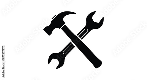 A striking black and white depiction of crossed hammer and wrench tools a bold silhouette