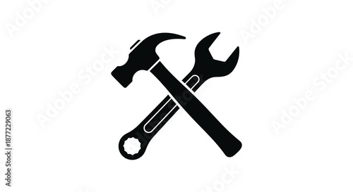 A striking depiction of crossed hammer and wrench tools in a dark silhouette