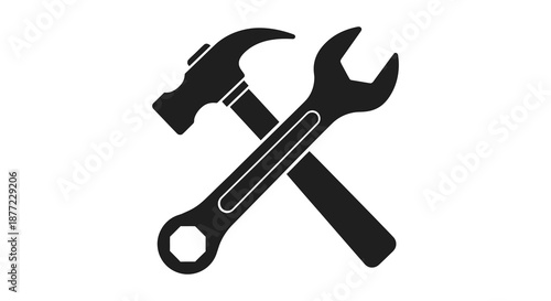 A striking depiction of crossed hammer and wrench tools in a black silhouette