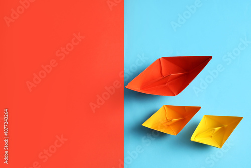 Colorful origami boats on c...