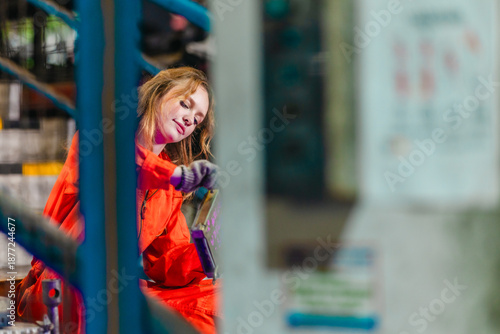 Wallpaper Mural Female Mechanic Inspecting Electronic Auto Parts on Industrial Stairs Torontodigital.ca