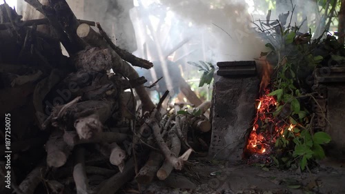 Burning branches and leaves in an old-fashioned kiln.
