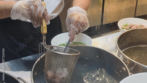 Vietnamese Soup Method is unique. Cook follows Vietnamese Soup Method at kitchen. Using Vietnamese Soup Method helps prepare delicious beef noodle soup with fresh herbs and hot bouillon.