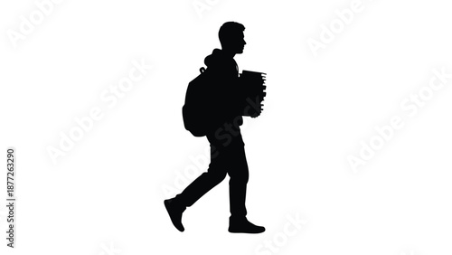 Silhouette of a dedicated male student walking purposefully while carrying a heavy stack of textbooks and wearing a backpack against a plain white background