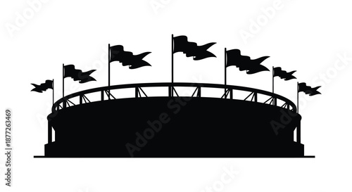 A striking black silhouette of a stadium with waving flags atop its structure silhouette