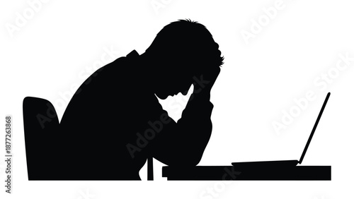 Silhouette of a deeply frustrated or exhausted person holding their head while sitting slumped over a desk with a laptop computer in a clear expression of intense stress or failure