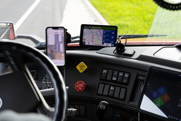 Truck driver uses GPS and mobile apps for navigation in Pleasant Grove California during a long haul trip