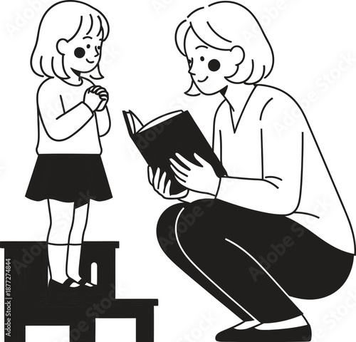 Woman reading to a little girl standing on a stool