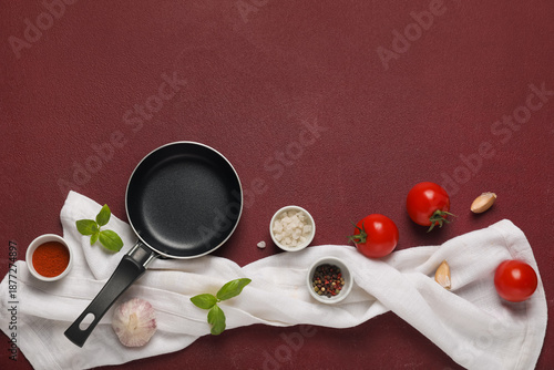 Empty frying pan with tomat...
