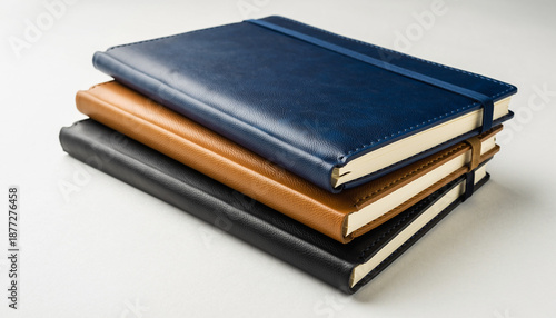 Stack of elegant leather-bound notebooks for planning and writing