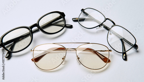 Collection of various eyeglasses with different styles on white background