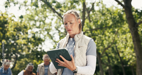 Bild auf Leinwand Woman, volunteer and confused with tablet at park for charity, checklist error and community service