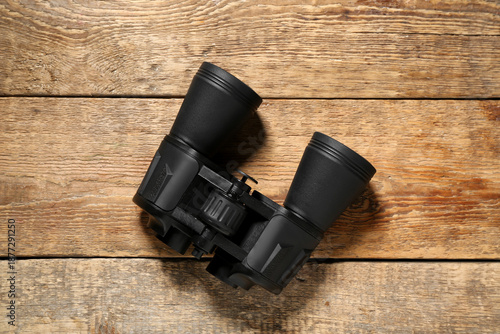 Black binoculars on wooden ...