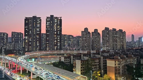 The busy road traffic on the main roads of Shenzhen city at dusk
