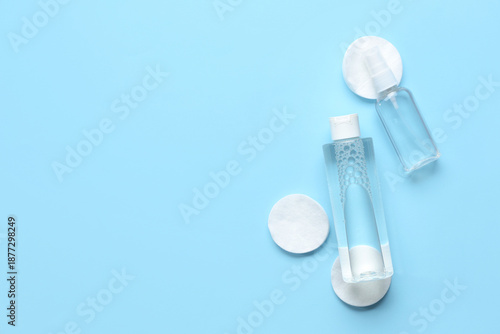 Cotton pads with bottles of...