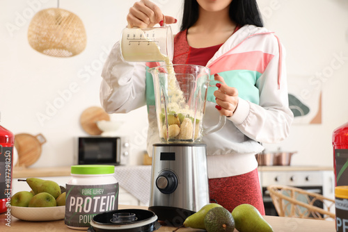Sporty young woman preparin...
