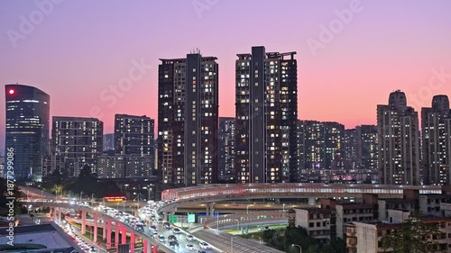 The busy road traffic on the main roads of Shenzhen city at dusk
