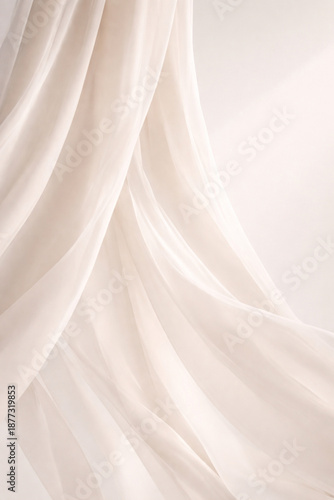 Softly draped translucent white fabric with gentle folds and ethereal light.