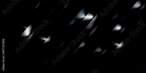 Abstract dark background with dynamic white and grey light streaks creating a sense of motion and modern design.