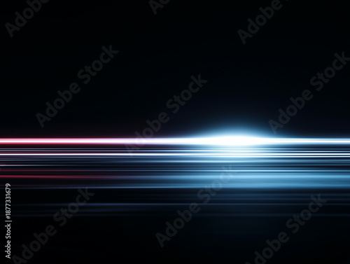 Horizontal multicolored light streaks with motion blur on dark background