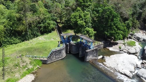 Drone Aerial Footage of Small Weir Dam Spillway and Sluice Gate on River