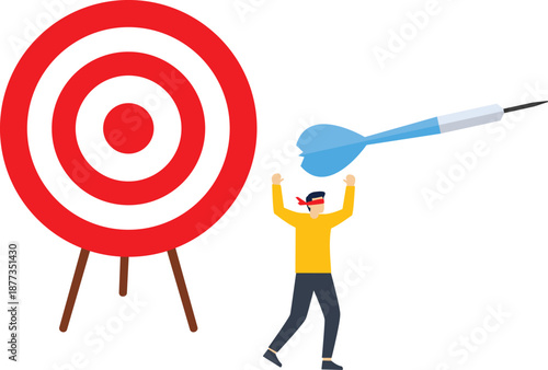 Blindfolded businessman using darts to shoot target

